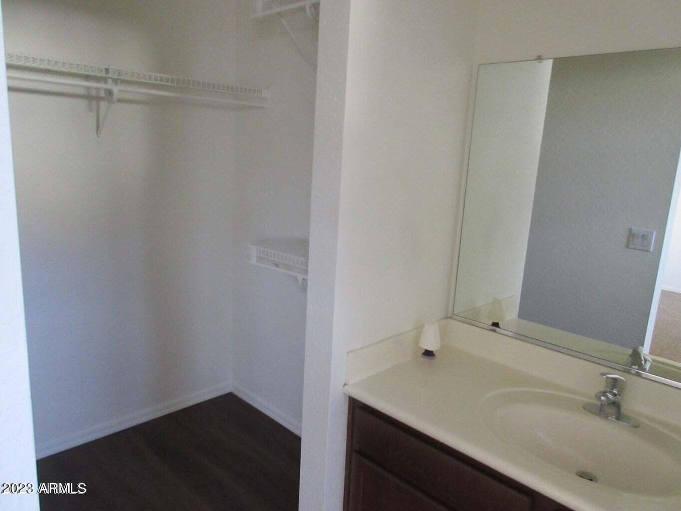 23742 West Hidalgo Avenue Buckeye, AZ 85326 - Photo 18 of 25 a bathroom with a sink and a mirror