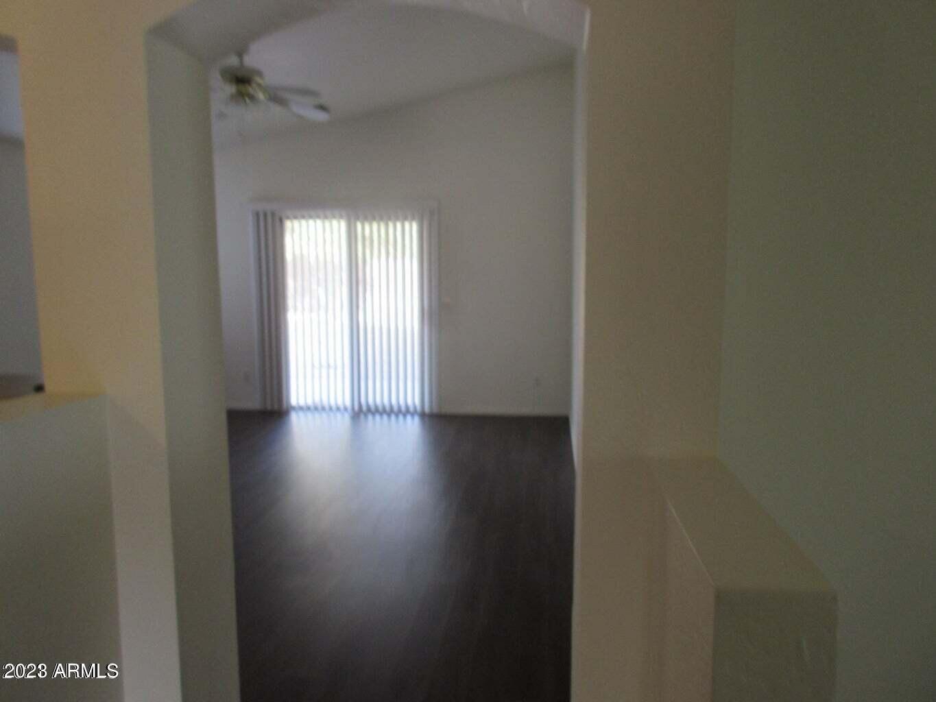 23742 West Hidalgo Avenue Buckeye, AZ 85326 - Photo 21 of 25 a view of a hallway with wooden floor