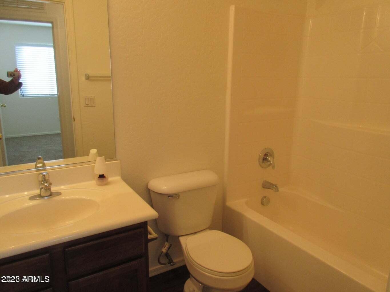 23742 West Hidalgo Avenue Buckeye, AZ 85326 - Photo 24 of 25 a bathroom with a sink a toilet and shower