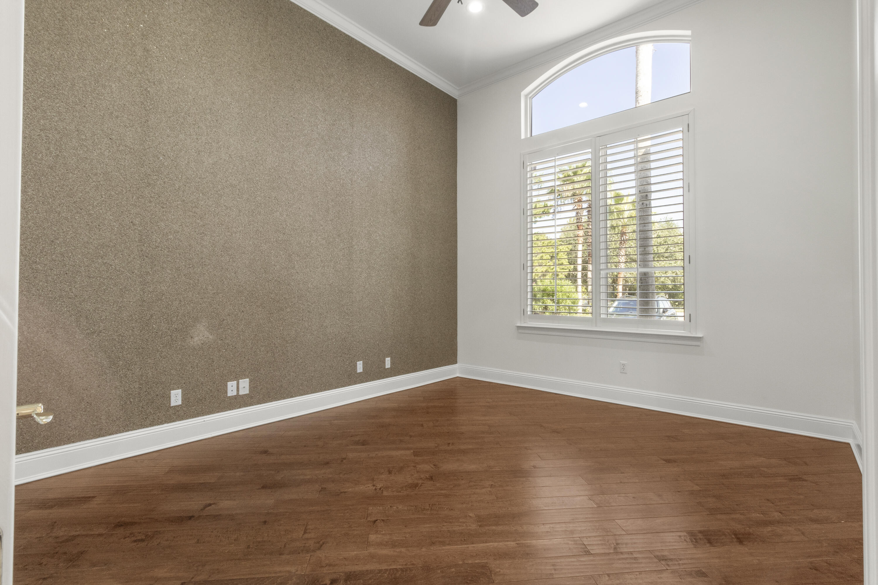 4304 Stonebridge Road Destin, FL 32541 - Photo 16 of 72 an empty room with wooden floor and windows