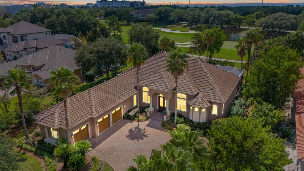 4304 Stonebridge Road Destin, FL 32541 - Photo 2 of 72 an aerial view of a house with a yard and lake view