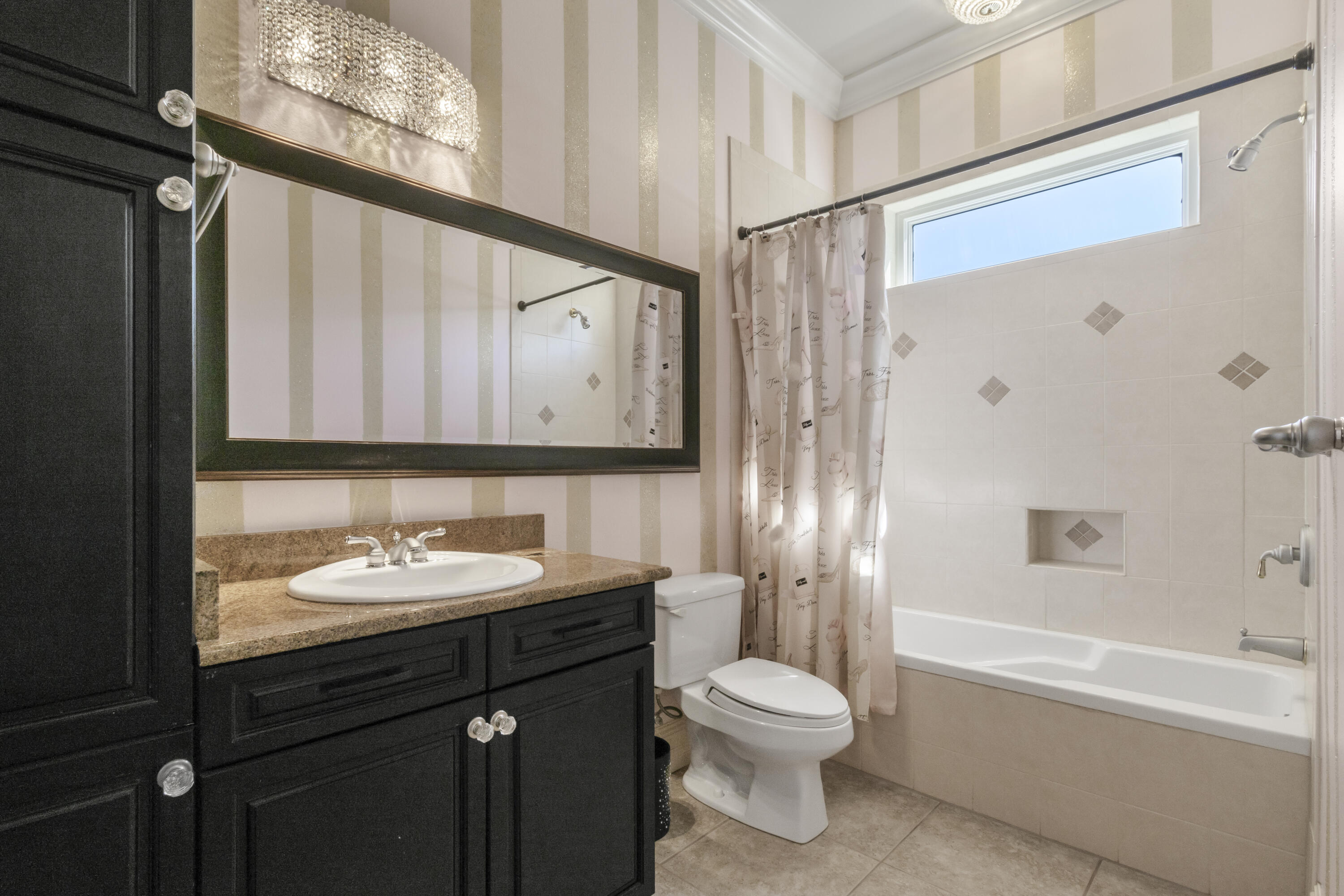 4304 Stonebridge Road Destin, FL 32541 - Photo 30 of 72 a bathroom with a sink a toilet and shower