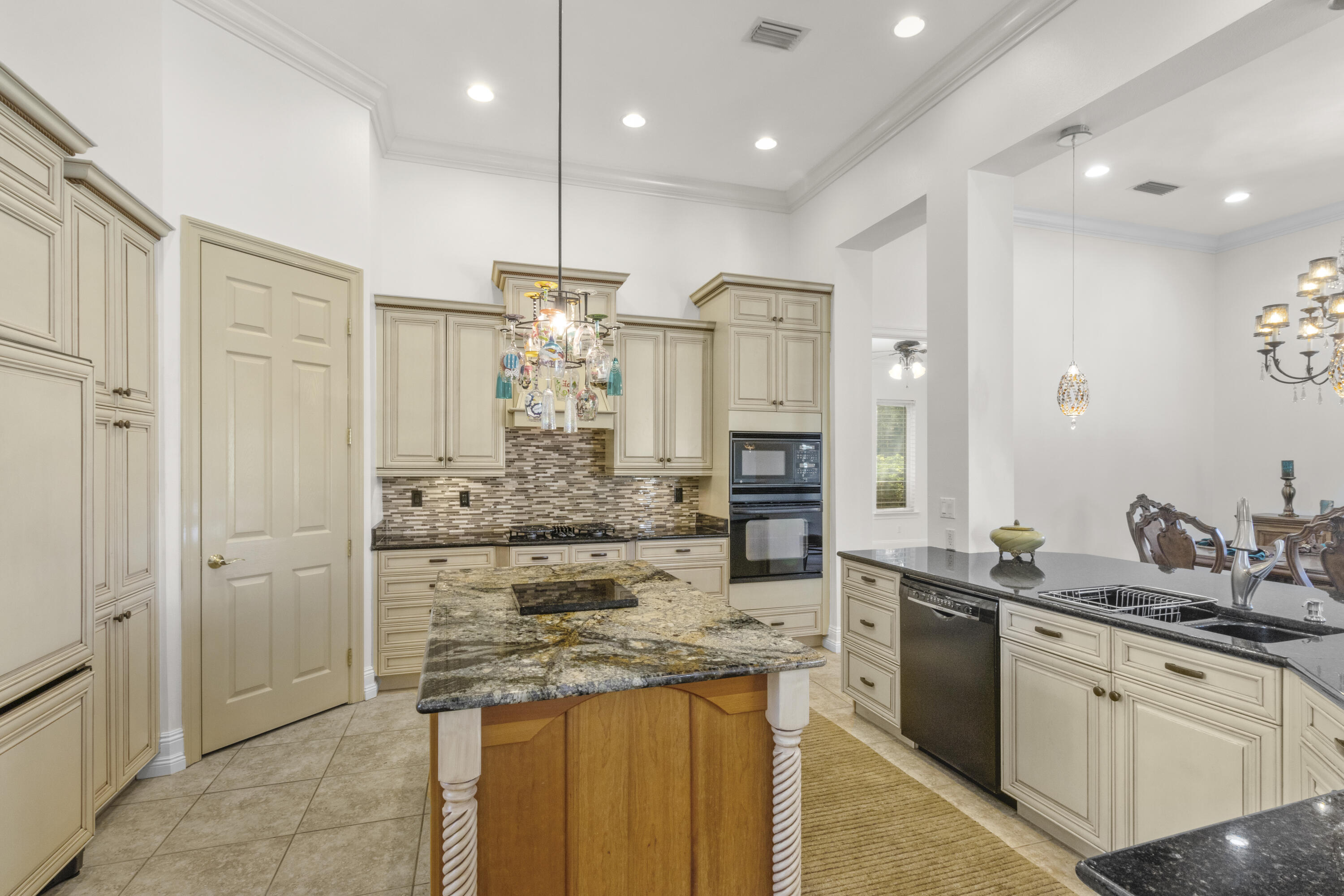 4304 Stonebridge Road Destin, FL 32541 - Photo 35 of 72 a kitchen with stainless steel appliances granite countertop a sink stove and refrigerator