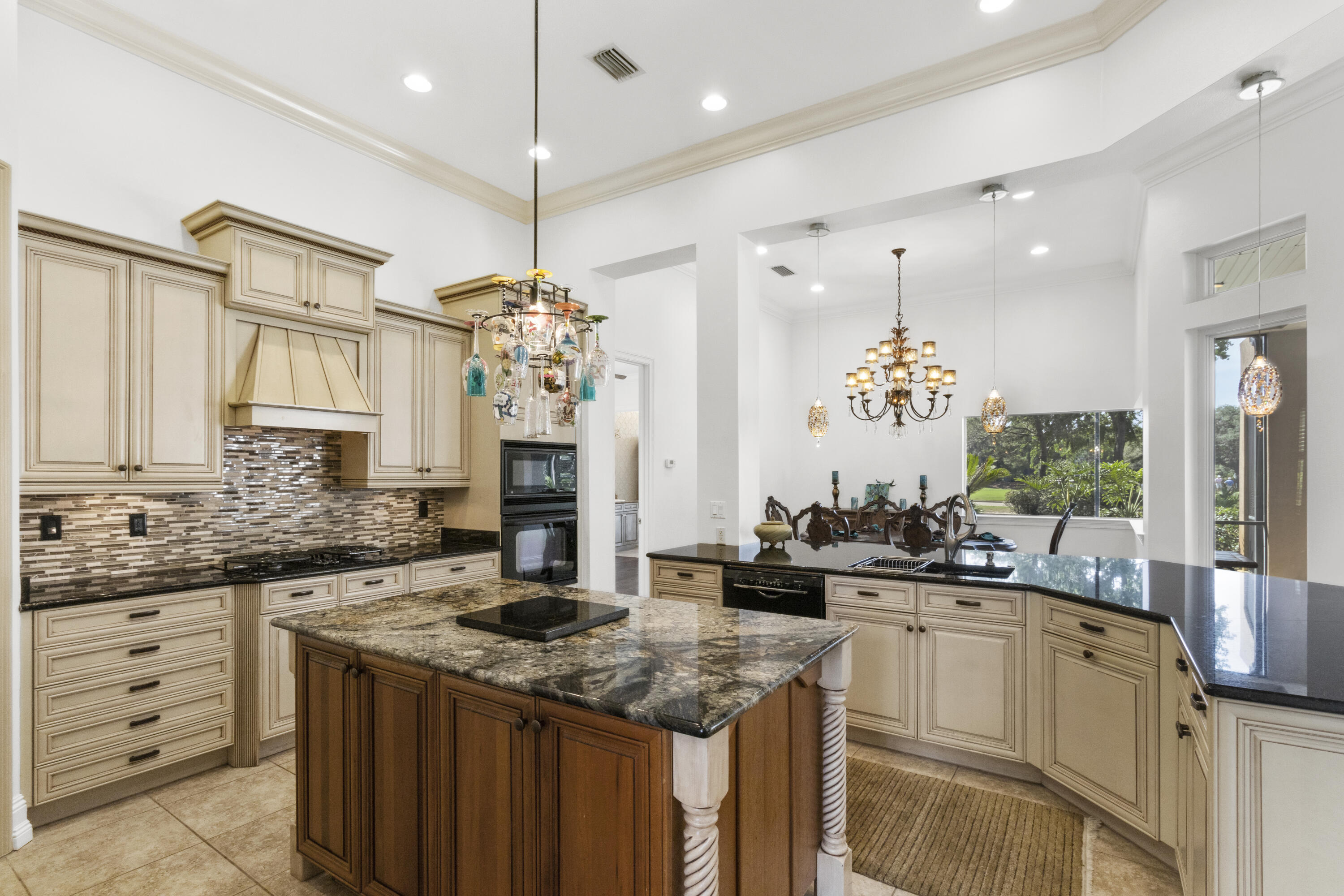 4304 Stonebridge Road Destin, FL 32541 - Photo 37 of 72 a kitchen with a sink stove and cabinets