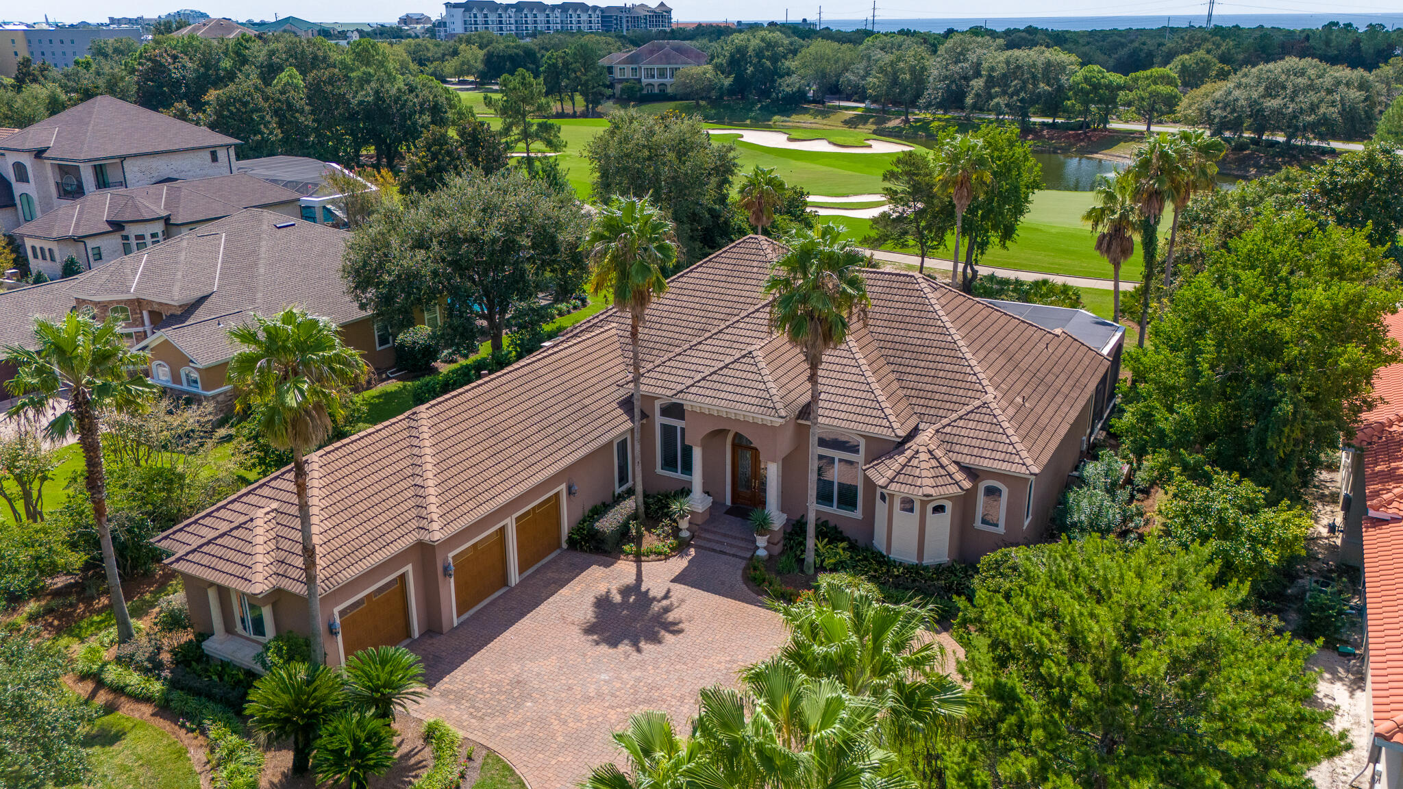 4304 Stonebridge Road Destin, FL 32541 - Photo 5 of 72 an aerial view of a house with a garden and lake view