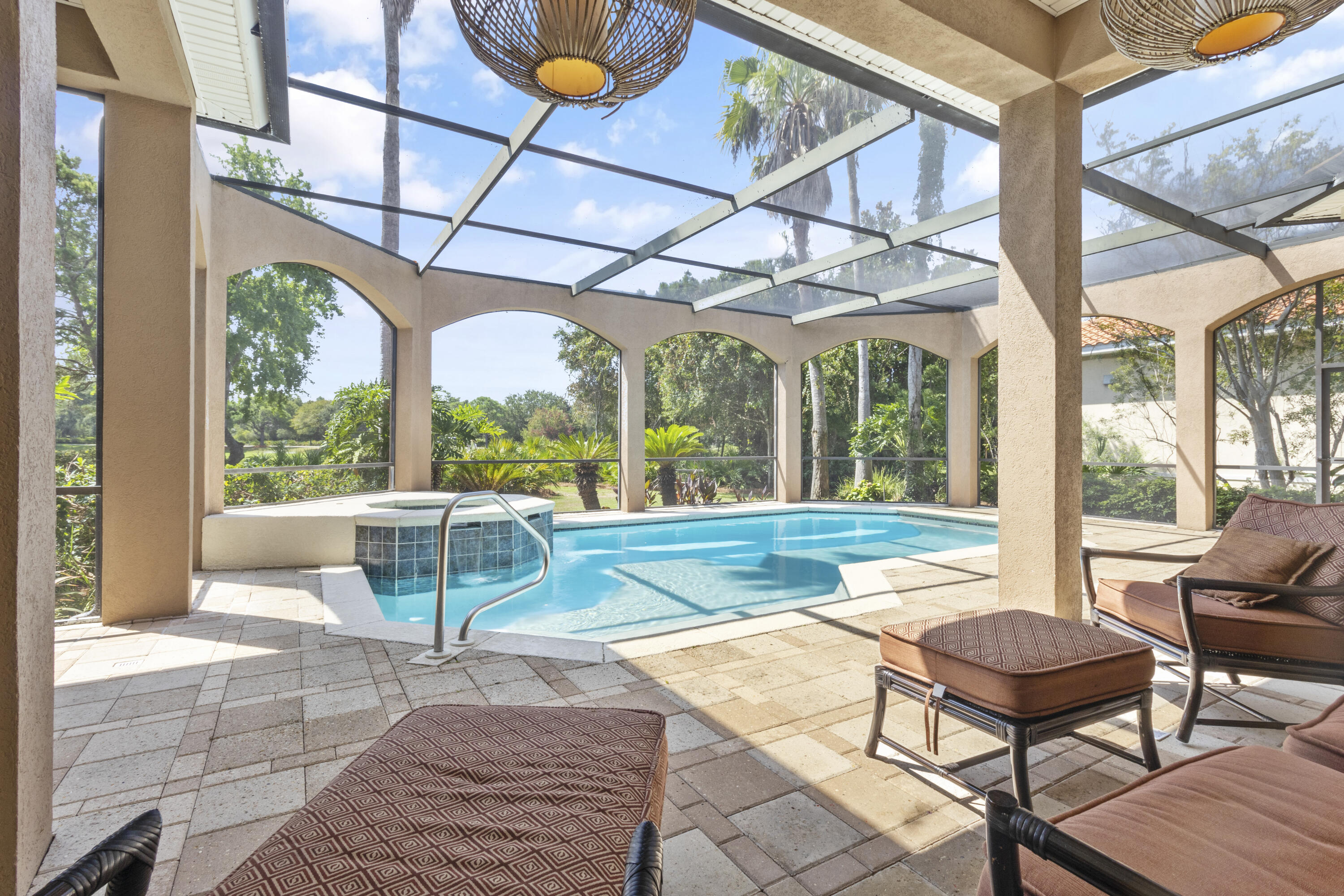 4304 Stonebridge Road Destin, FL 32541 - Photo 60 of 72 a view of a patio with a dining table and chairs