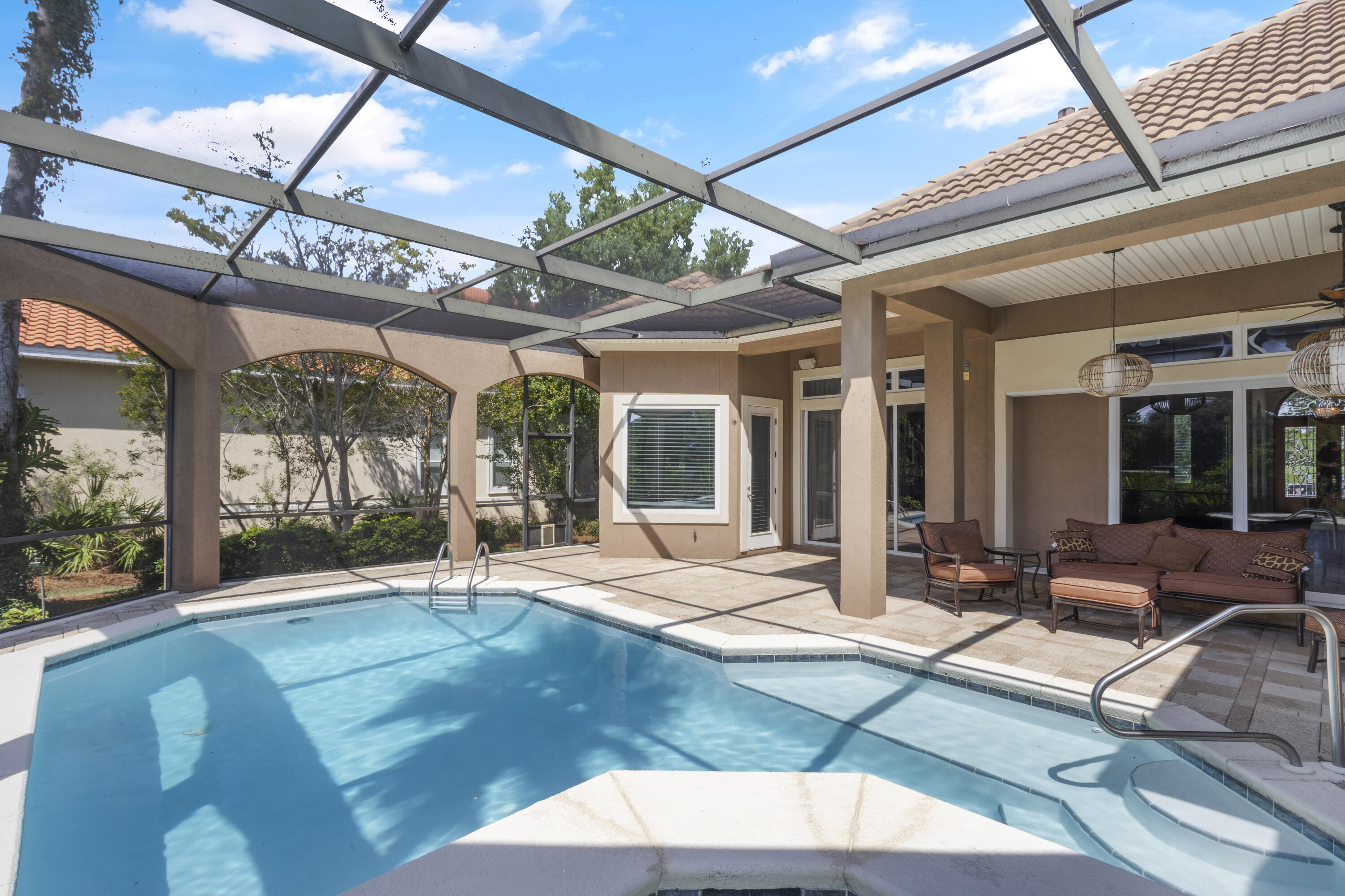 4304 Stonebridge Road Destin, FL 32541 - Photo 62 of 72 a view of a patio with a table and chairs