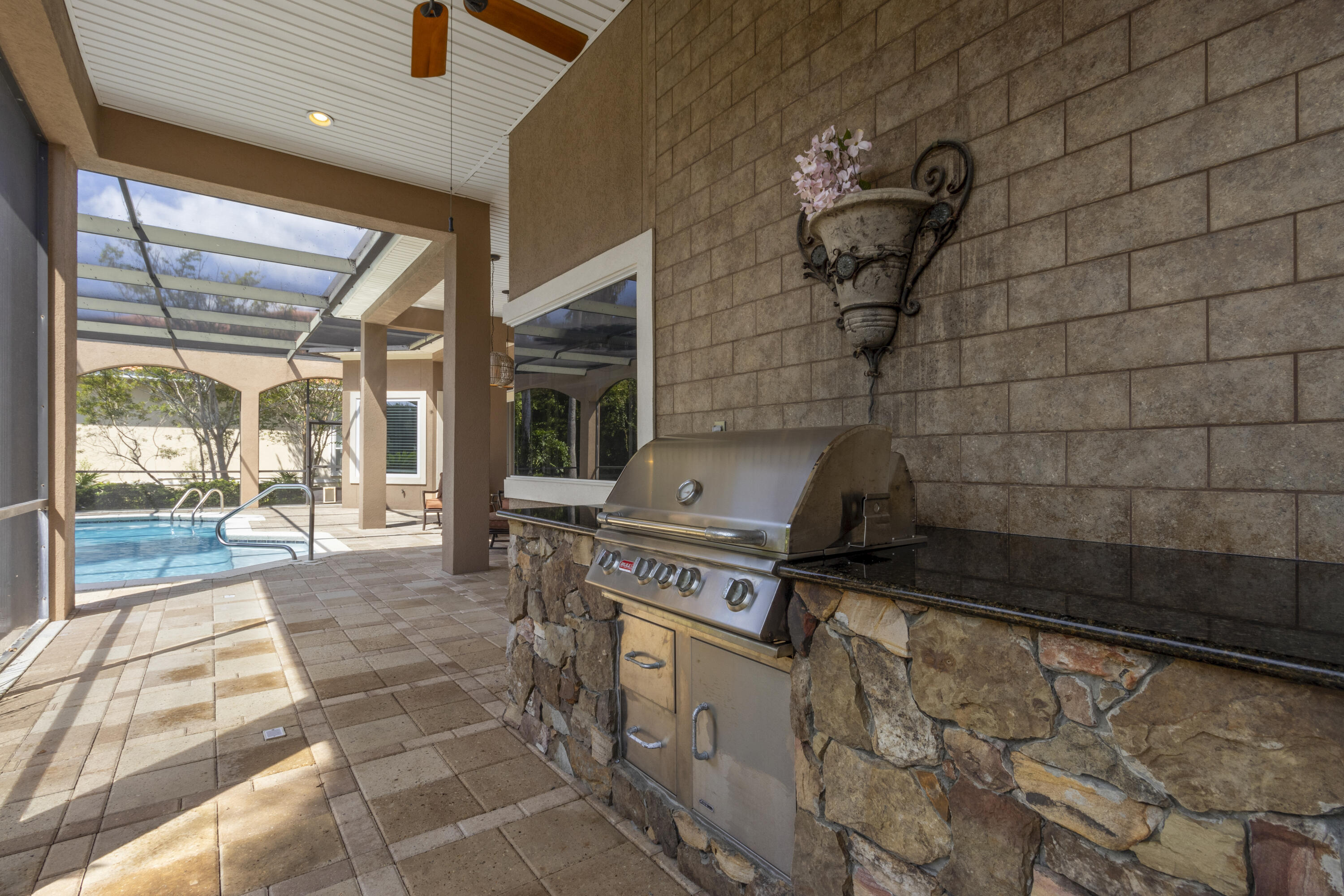 4304 Stonebridge Road Destin, FL 32541 - Photo 67 of 72 a kitchen with a stove and a shower