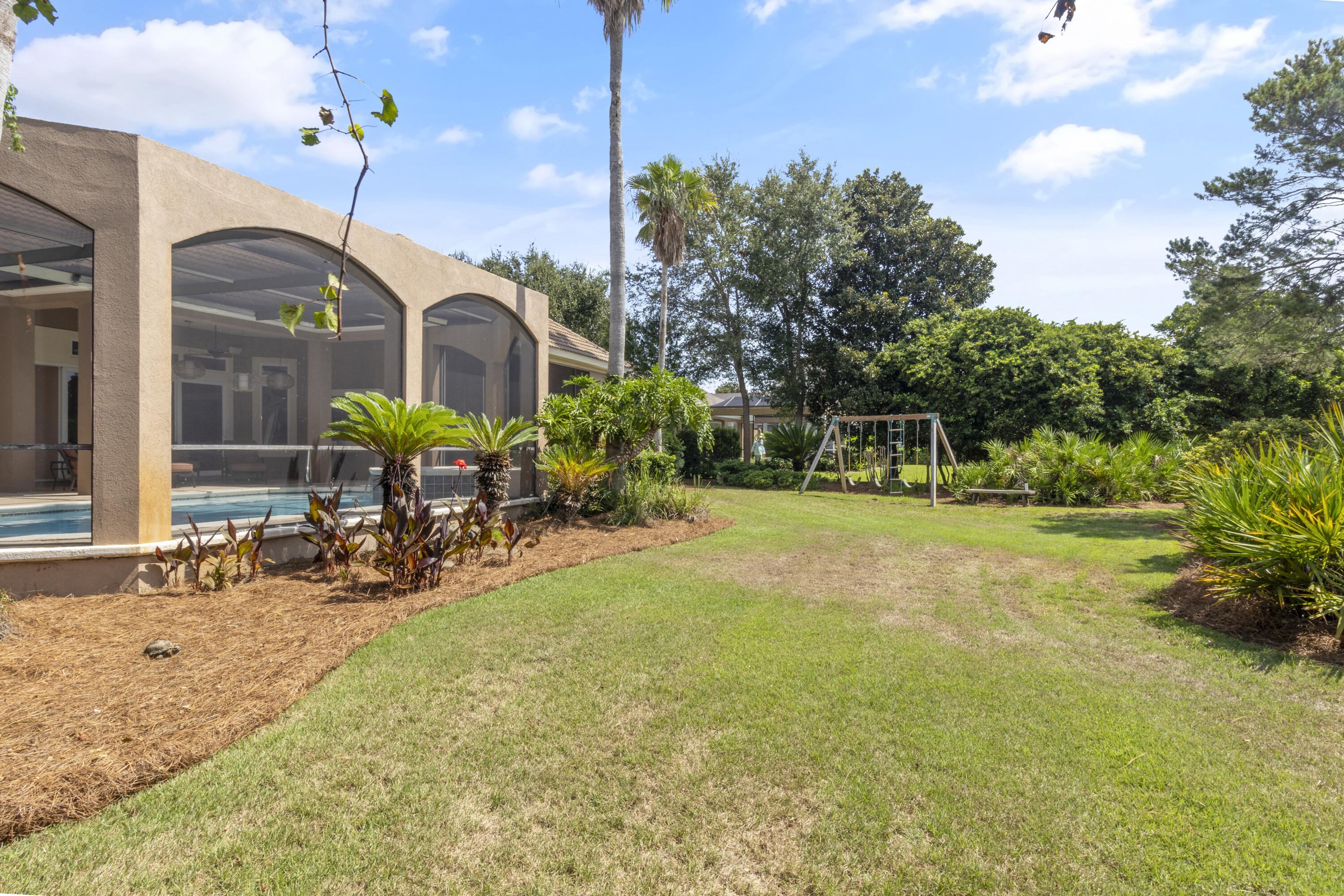 4304 Stonebridge Road Destin, FL 32541 - Photo 68 of 72 a view of a house with backyard porch and sitting area