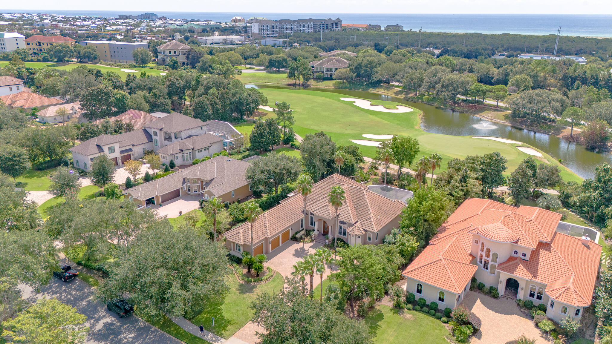4304 Stonebridge Road Destin, FL 32541 - Photo 7 of 72 an aerial view of lake residential house with swimming pool and mountain view
