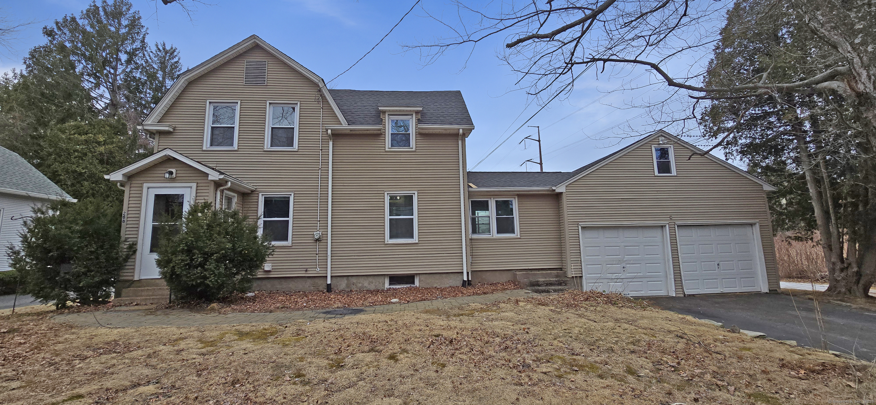 288 Rood Avenue Windsor, CT 06095 - Photo 1 of 1 a front view of a house with a yard and garage