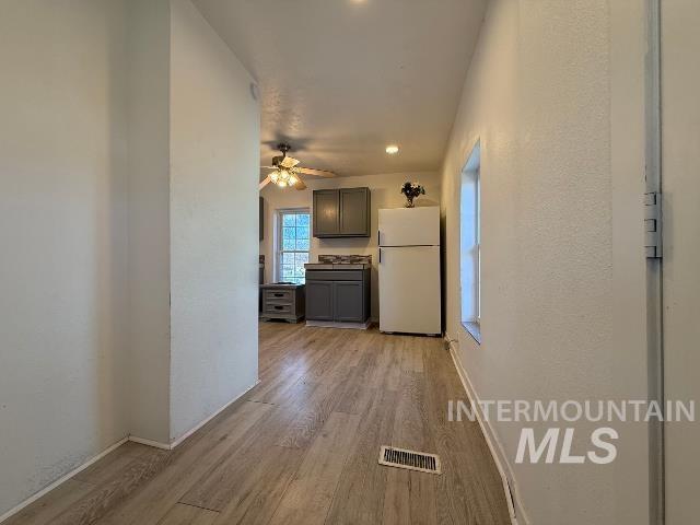 902 East Main Street Weiser, ID 83672 - Photo 15 of 45 Corridor featuring light wood finished floors, recessed lighting, and a textured wall