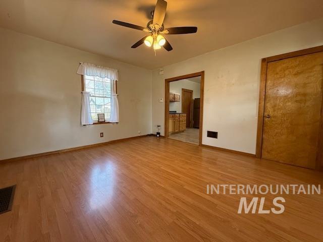 902 East Main Street Weiser, ID 83672 - Photo 18 of 45 Unfurnished bedroom with light wood-style flooring and a ceiling fan