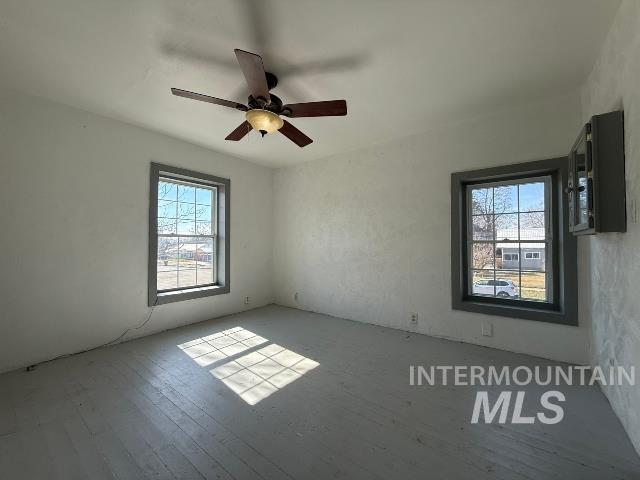 902 East Main Street Weiser, ID 83672 - Photo 25 of 45 Empty room with wood-type flooring and ceiling fan