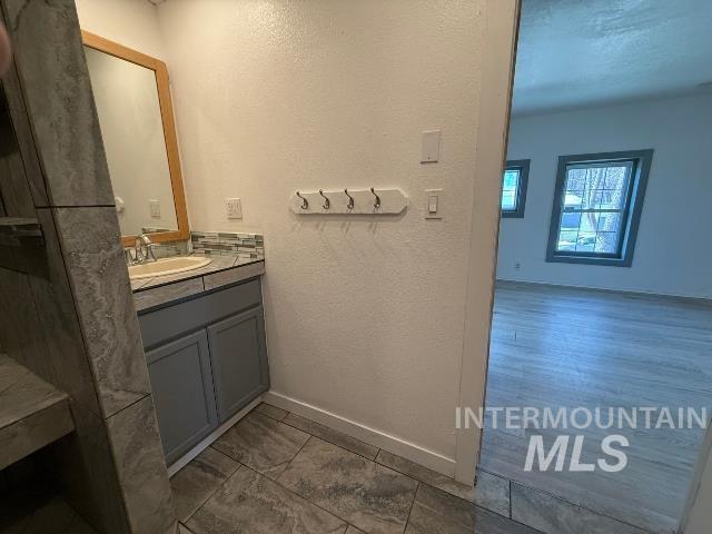 902 East Main Street Weiser, ID 83672 - Photo 36 of 45 Bathroom featuring a textured wall and vanity