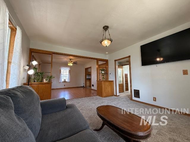 902 East Main Street Weiser, ID 83672 - Photo 4 of 45 Living area featuring carpet and a ceiling fan
