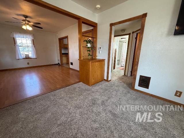 902 East Main Street Weiser, ID 83672 - Photo 8 of 45 Empty room featuring a ceiling fan and carpet flooring