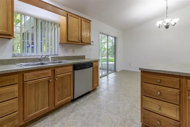 a kitchen with a refrigerator and a cabinets