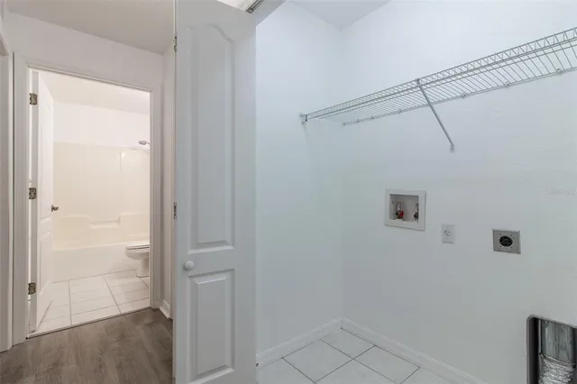 a view of a room with large windows and a big yard