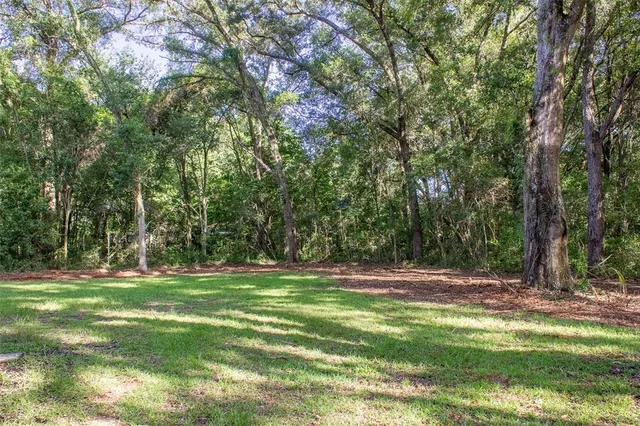 an aerial view of a house with outdoor space