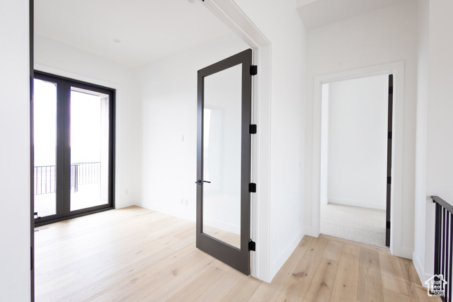 2132 East Outlaw Road, Unit 49 Kamas, UT 84036 - Photo 12 of 44 Corridor featuring french doors, light wood finished floors, and baseboards