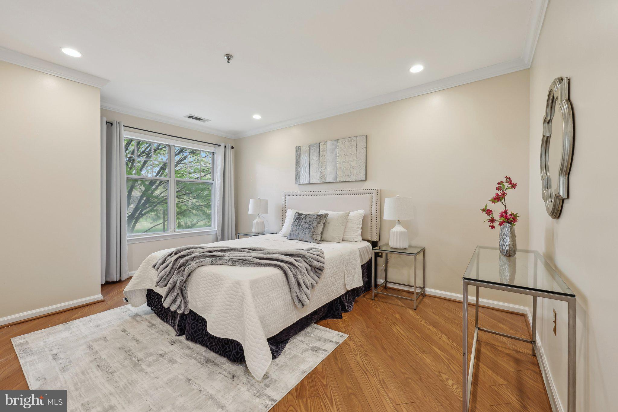 5565 Seminary Road, Unit 108 Falls Church, VA 22041 - Photo 12 of 22 a bed room with a bed and a window