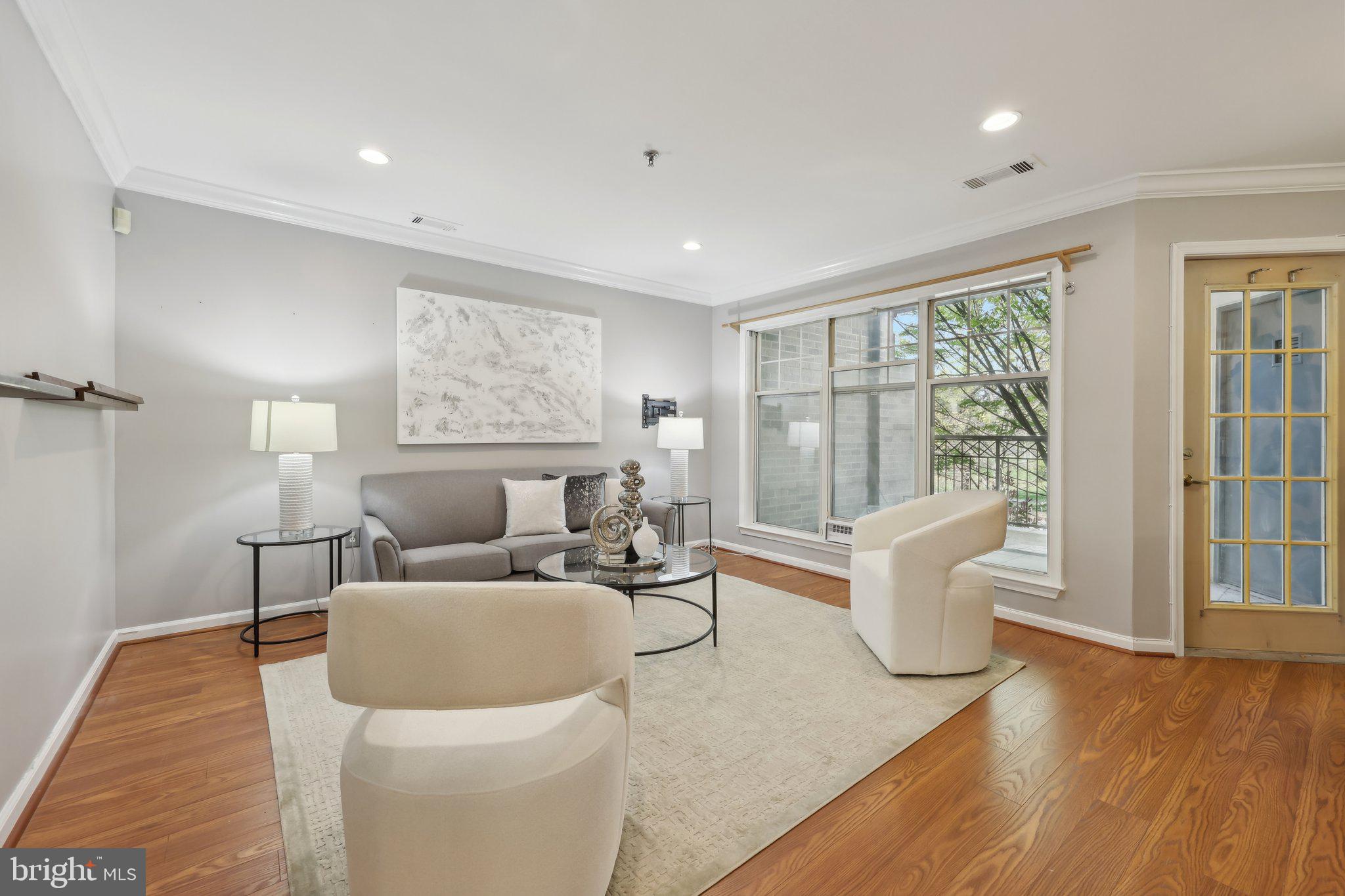 5565 Seminary Road, Unit 108 Falls Church, VA 22041 - Photo 2 of 22 a living room with furniture and a large window