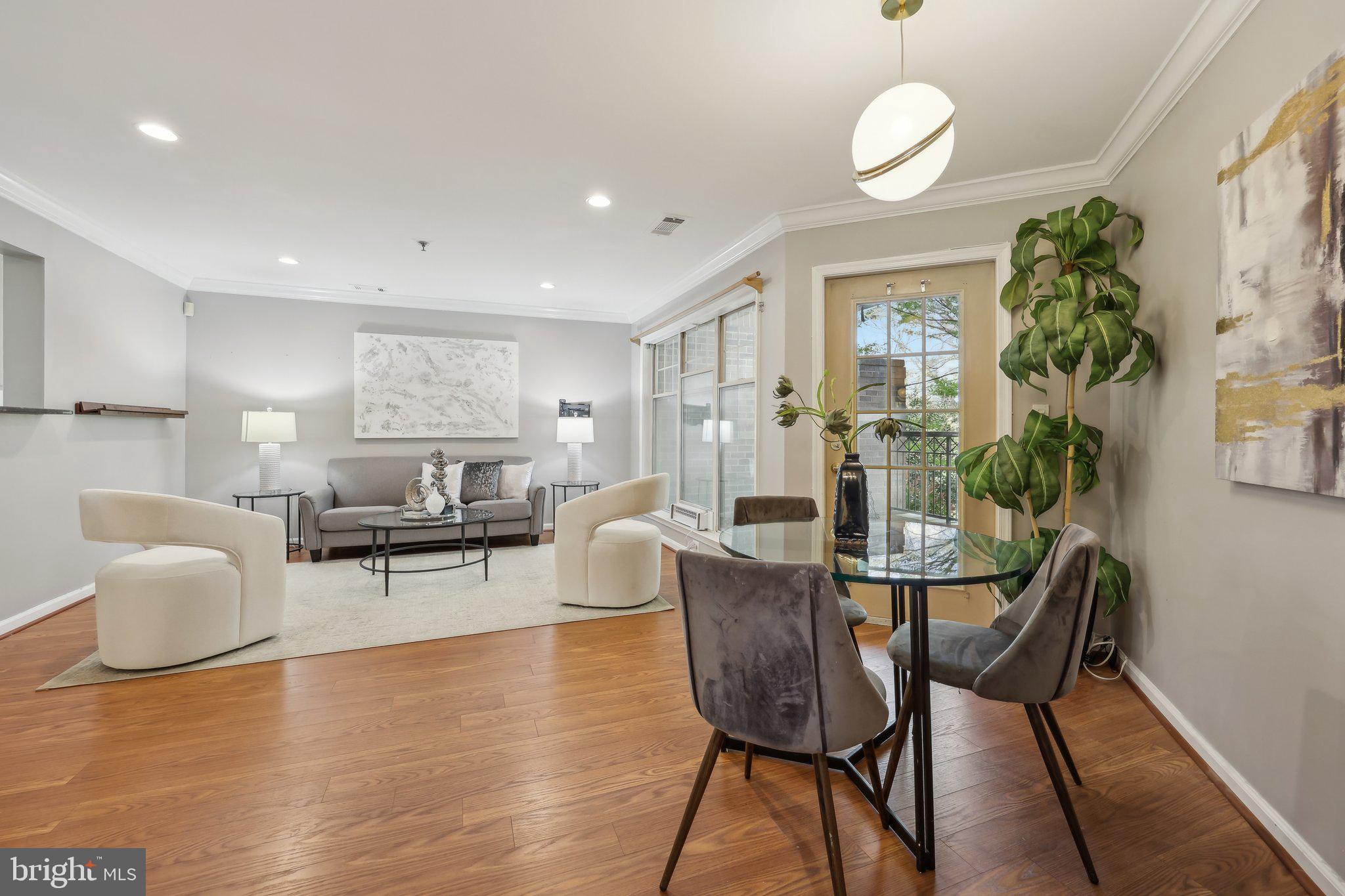 5565 Seminary Road, Unit 108 Falls Church, VA 22041 - Photo 4 of 22 a living room with furniture and a wooden floor