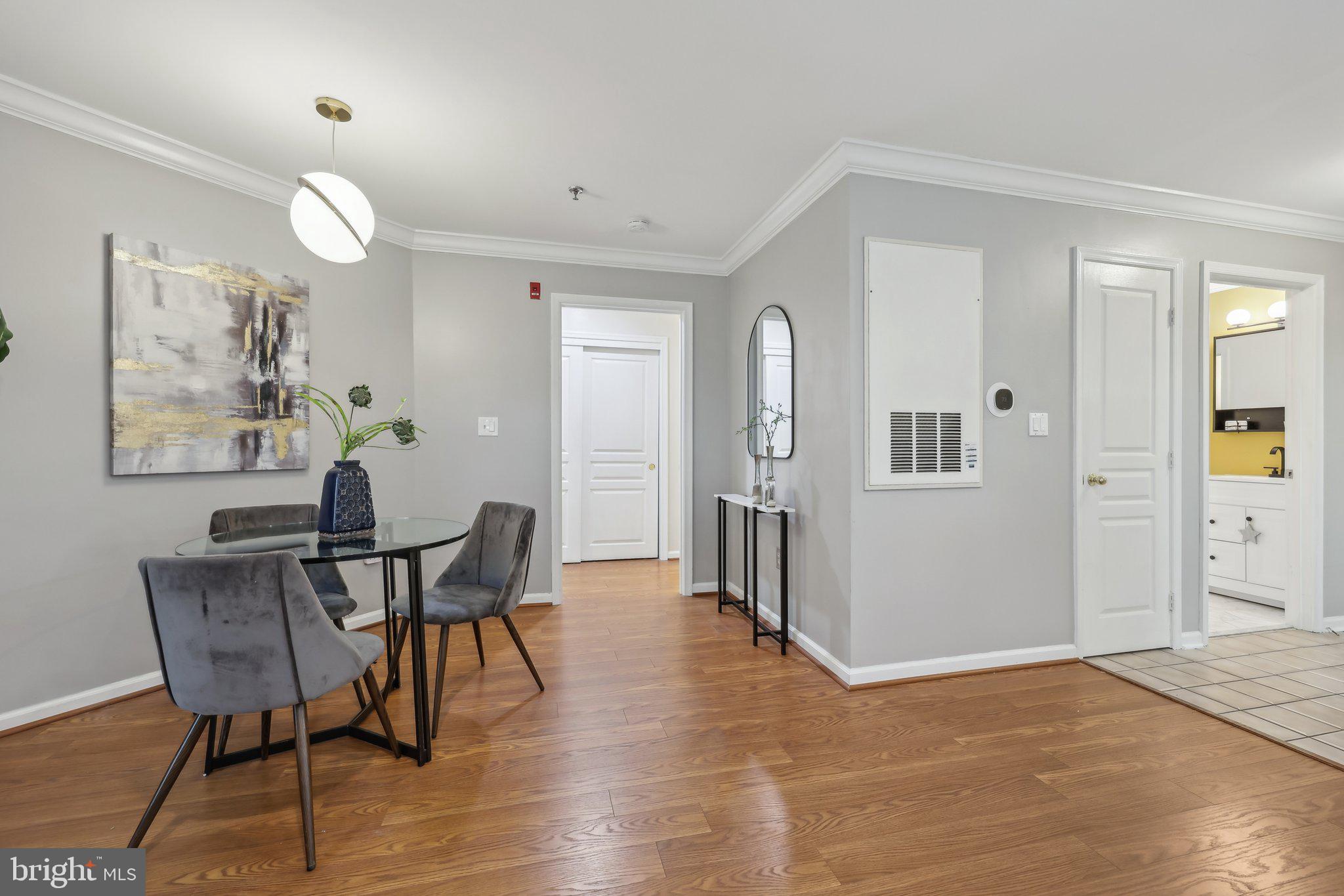 5565 Seminary Road, Unit 108 Falls Church, VA 22041 - Photo 5 of 22 a view of a dining room with furniture and wooden floor