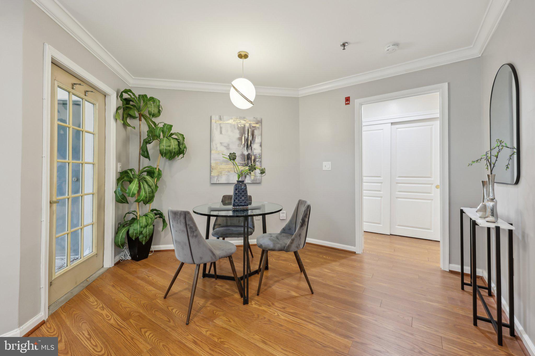 5565 Seminary Road, Unit 108 Falls Church, VA 22041 - Photo 6 of 22 a view of a dining room with furniture window and wooden floor