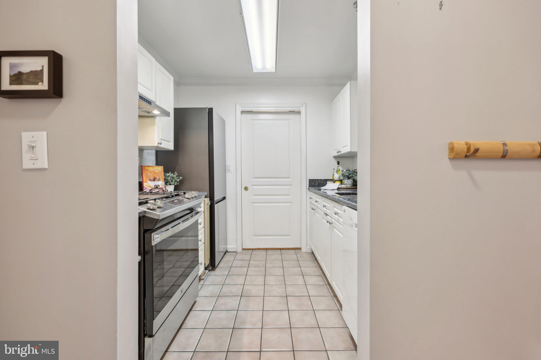 5565 Seminary Road, Unit 108 Falls Church, VA 22041 - Photo 8 of 22 a kitchen with a refrigerator stove and cabinets
