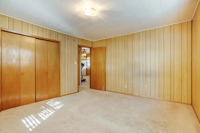 a view of a room with a wooden walls