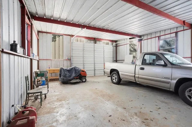 a view of cars parked in front of a house