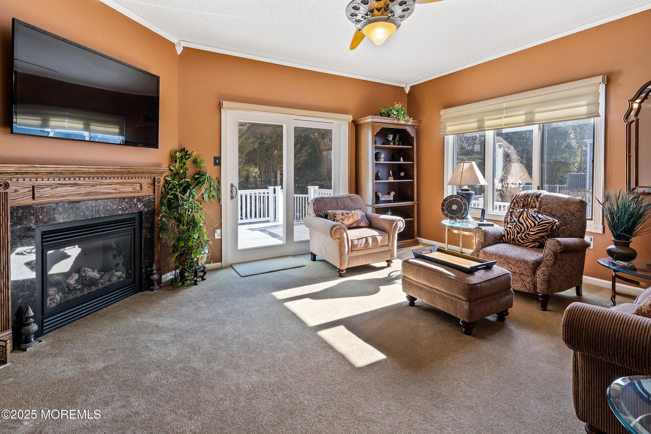 5 Beach Drive Little Egg Harbor, NJ 08087 - Photo 19 of 47 a living room with furniture a flat screen tv and a fireplace