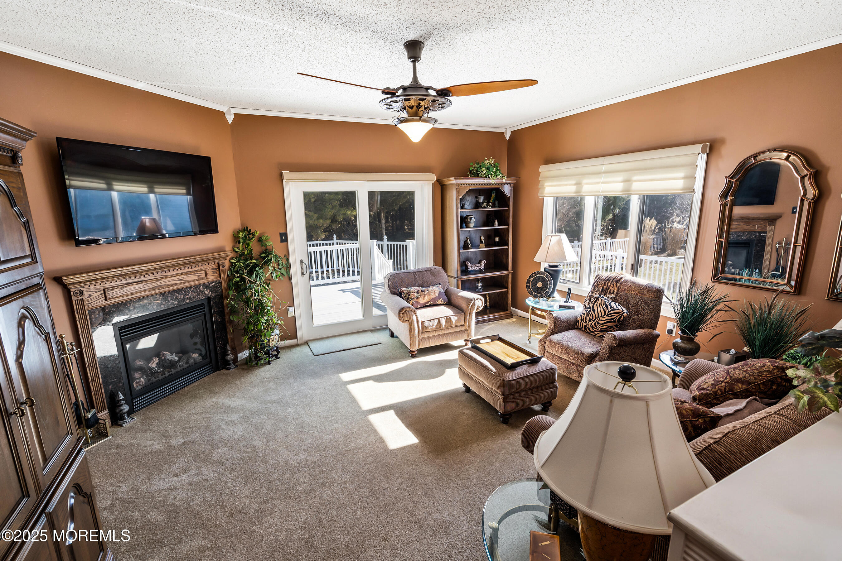 5 Beach Drive Little Egg Harbor, NJ 08087 - Photo 20 of 47 a living room with furniture a fireplace and a flat screen tv