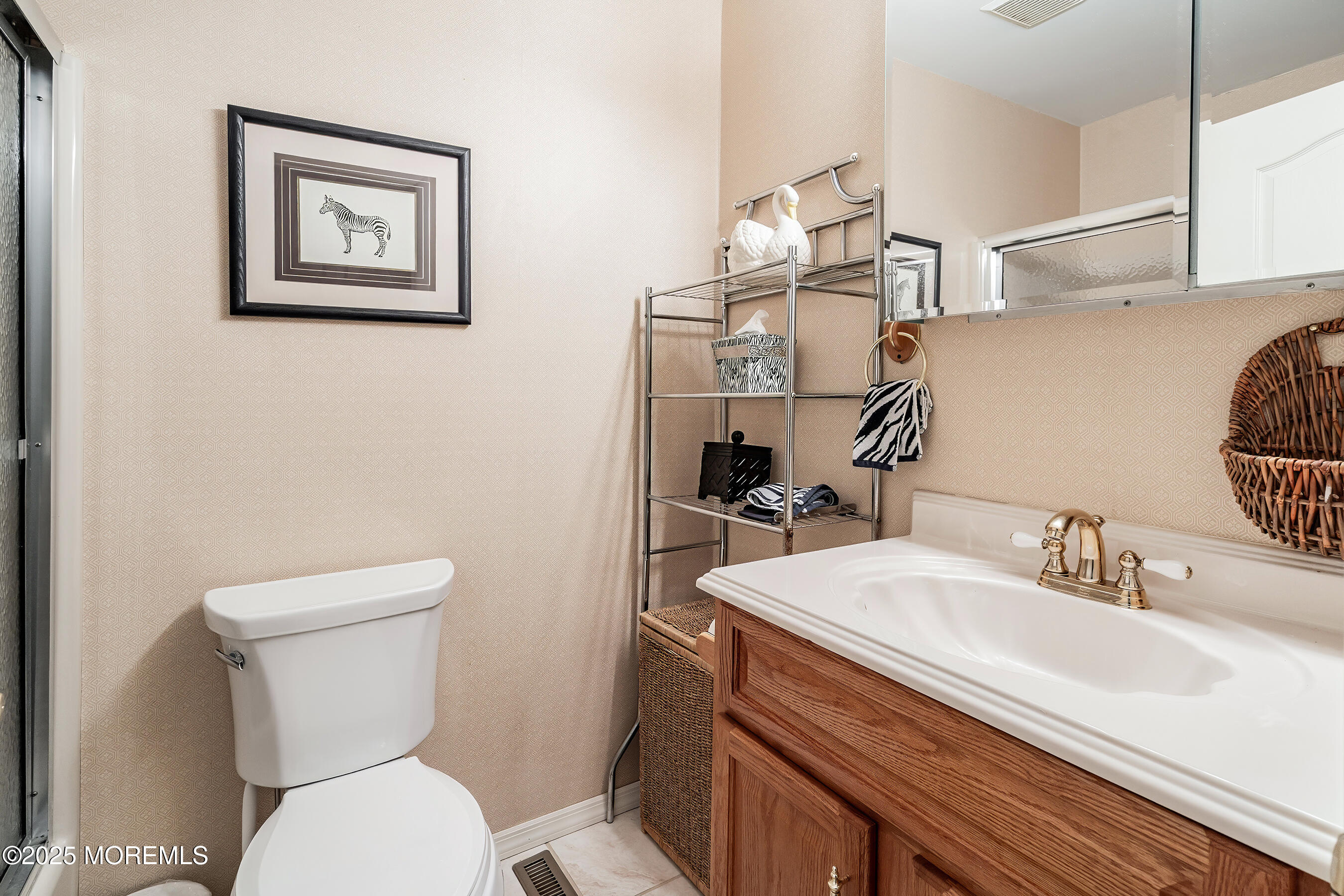 5 Beach Drive Little Egg Harbor, NJ 08087 - Photo 24 of 47 a bathroom with a toilet sink and mirror
