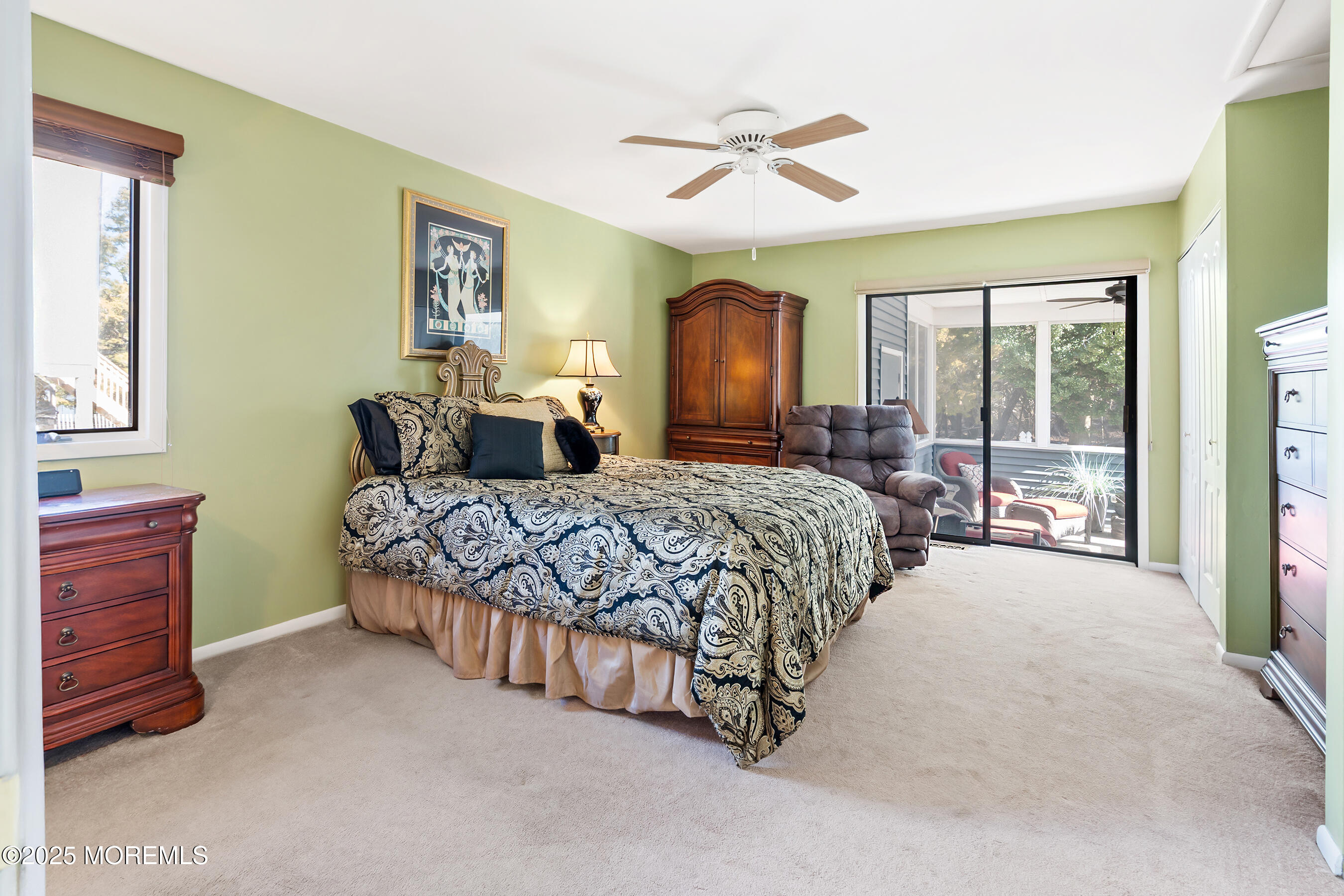 5 Beach Drive Little Egg Harbor, NJ 08087 - Photo 26 of 47 a bedroom with a large bed and a chandelier