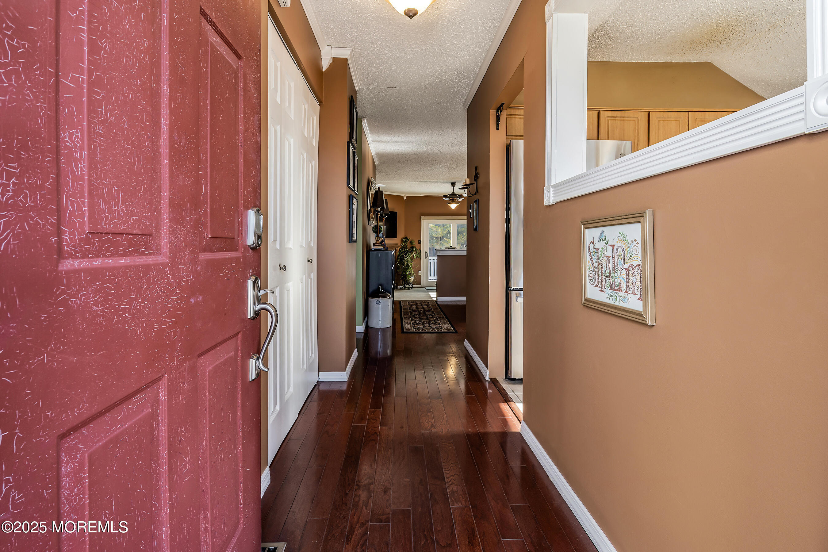 5 Beach Drive Little Egg Harbor, NJ 08087 - Photo 8 of 47 a view of a hallway with wooden floor and staircase
