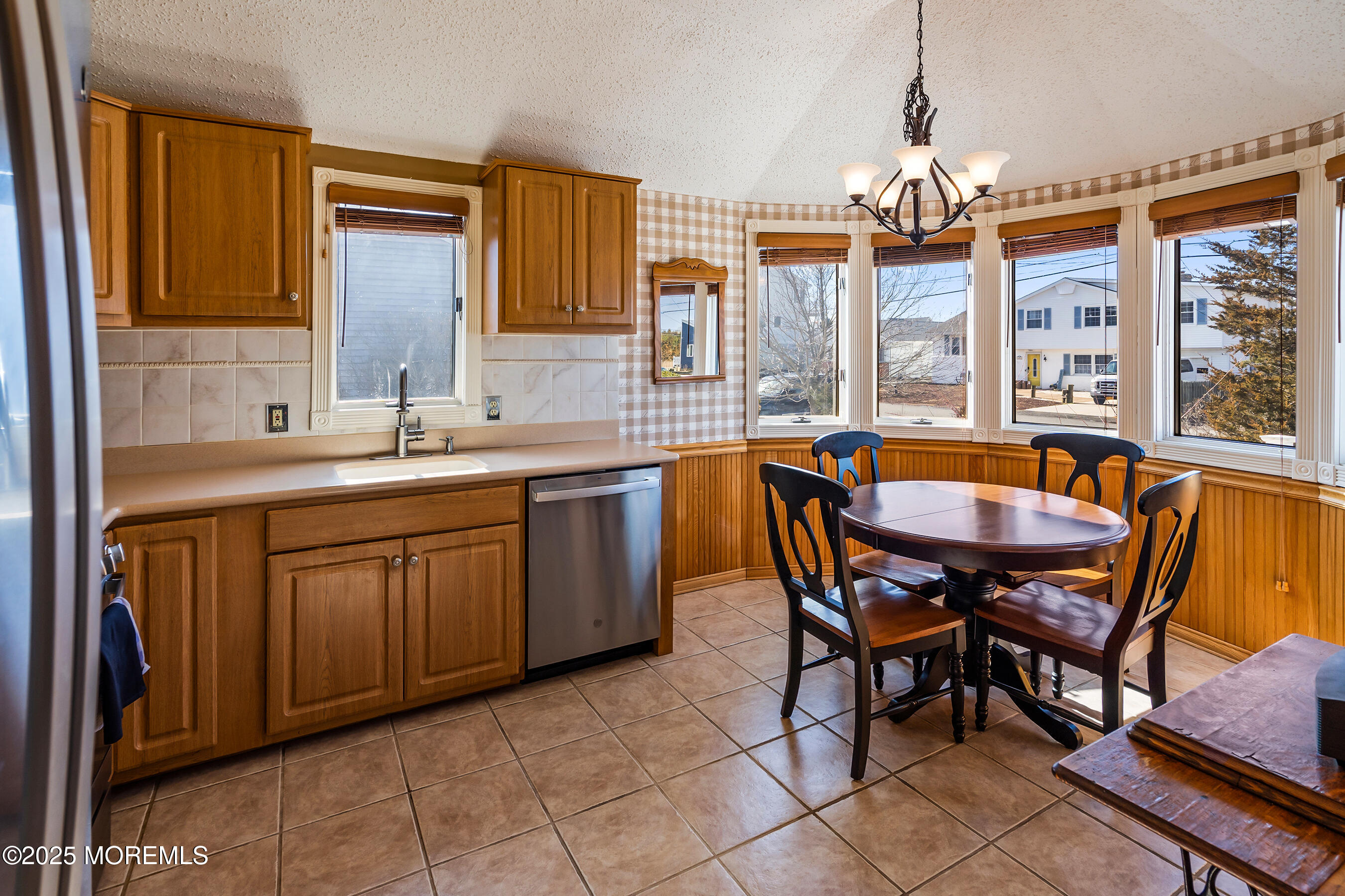 5 Beach Drive Little Egg Harbor, NJ 08087 - Photo 10 of 47 a dining hall with stainless steel appliances granite countertop a sink a stove a dining table and chairs