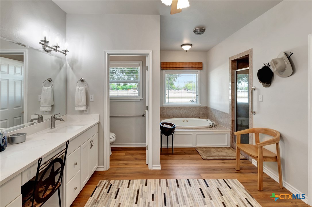 202 Prairie View Road Victoria, TX 77904 - Photo 16 of 47 a bathroom with a sink a mirror and a shower