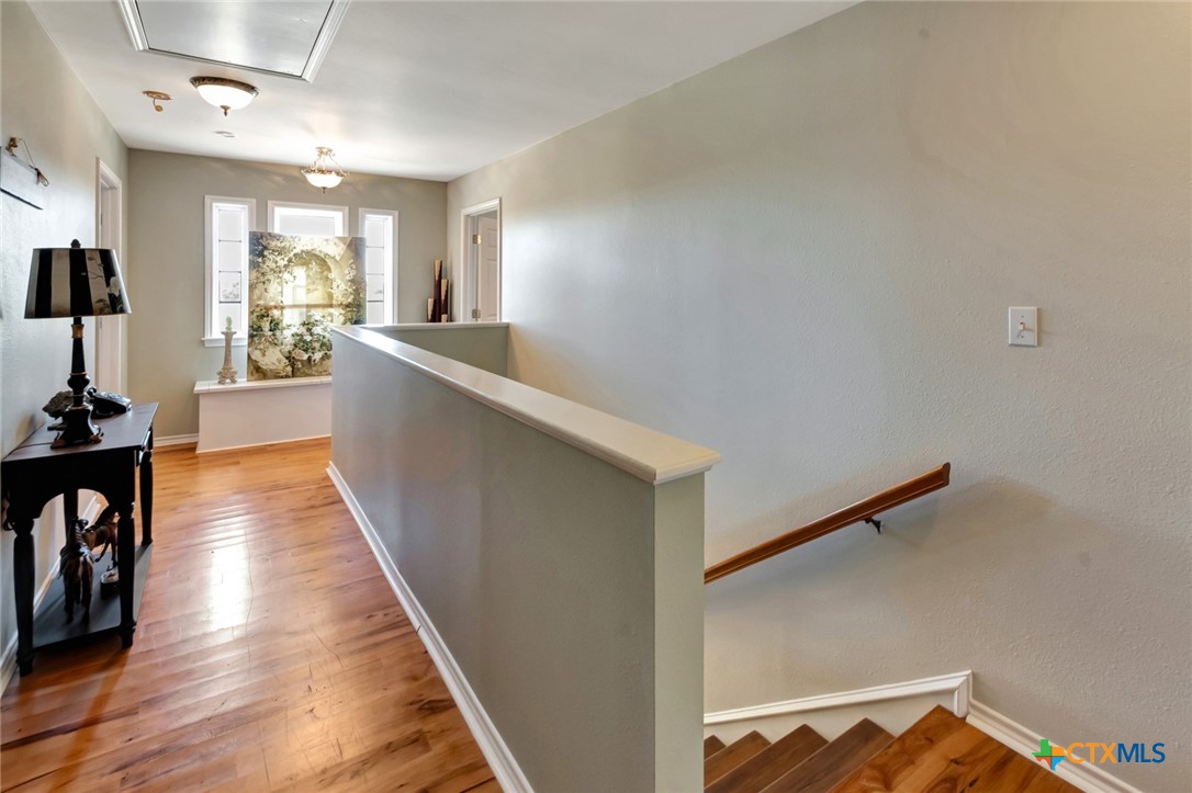 202 Prairie View Road Victoria, TX 77904 - Photo 20 of 47 a view of a hallway with wooden floor and furniture