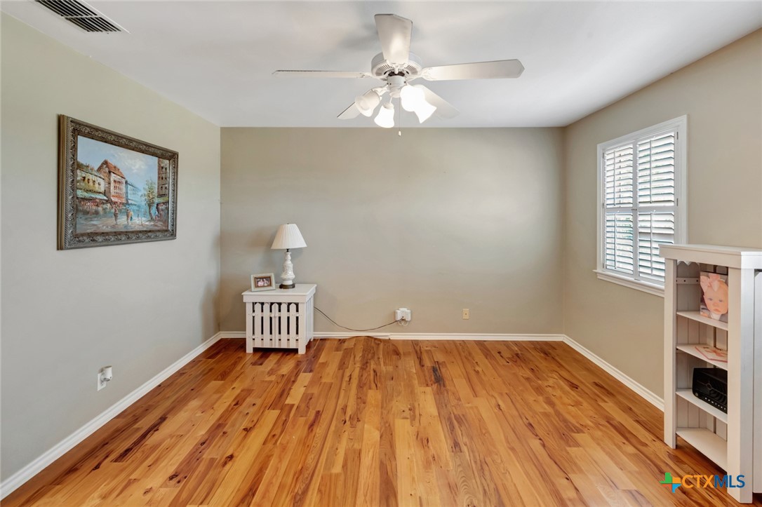 202 Prairie View Road Victoria, TX 77904 - Photo 22 of 47 a view of a room with wooden floor closet and windows