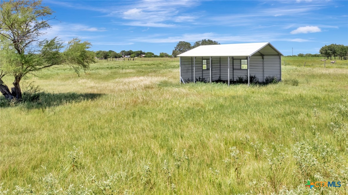 202 Prairie View Road Victoria, TX 77904 - Photo 35 of 47 a view of a house with a yard and a lake view