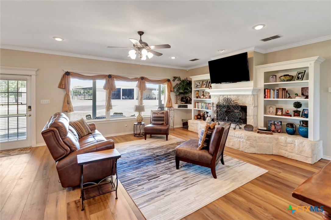 202 Prairie View Road Victoria, TX 77904 - Photo 6 of 47 a living room with furniture a fireplace and a flat screen tv