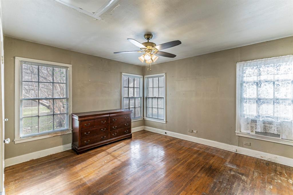 3320 Parrott Avenue Waco, TX 76707 - Photo 11 of 15 a view of an empty room with a window and wooden floor