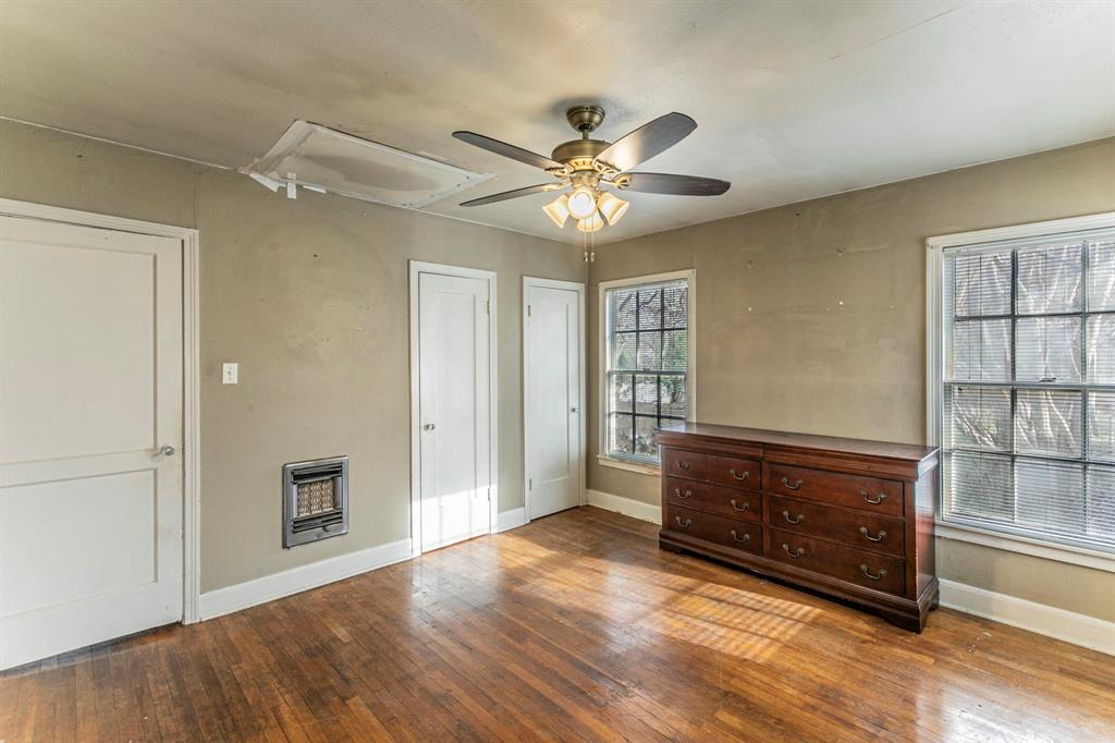 3320 Parrott Avenue Waco, TX 76707 - Photo 12 of 15 wooden floor with chandelier fan and windows