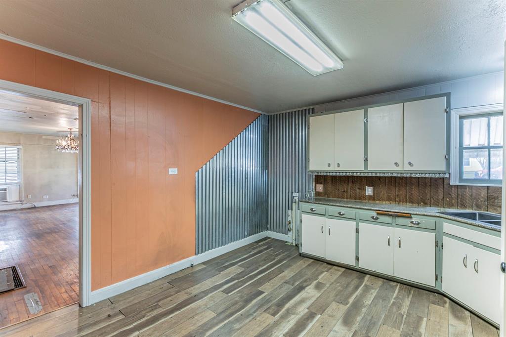 3320 Parrott Avenue Waco, TX 76707 - Photo 6 of 15 a kitchen with a sink and cabinets