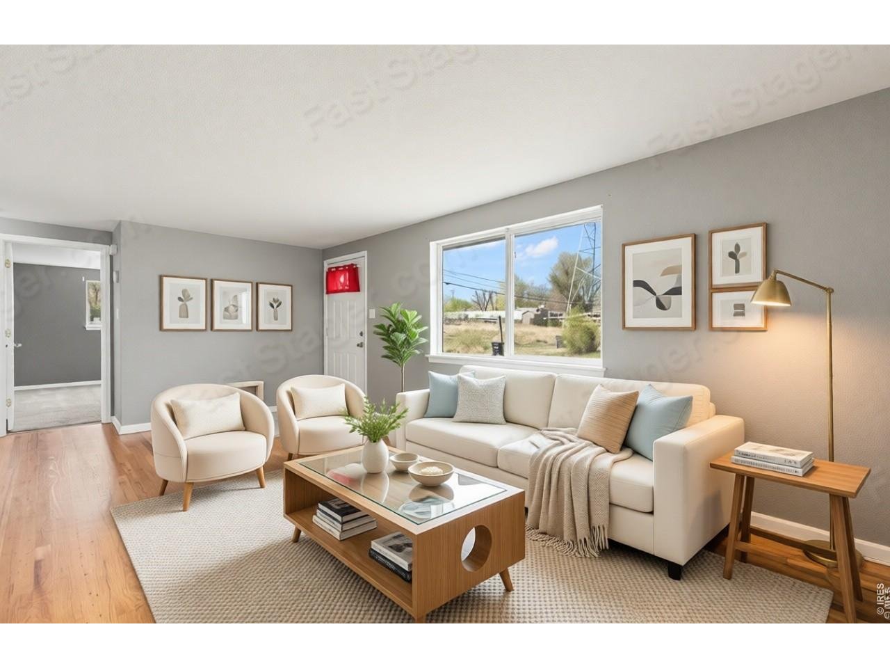 840 South Stuart Street Denver, CO 80219 - Photo 2 of 26 a living room with furniture and a large window