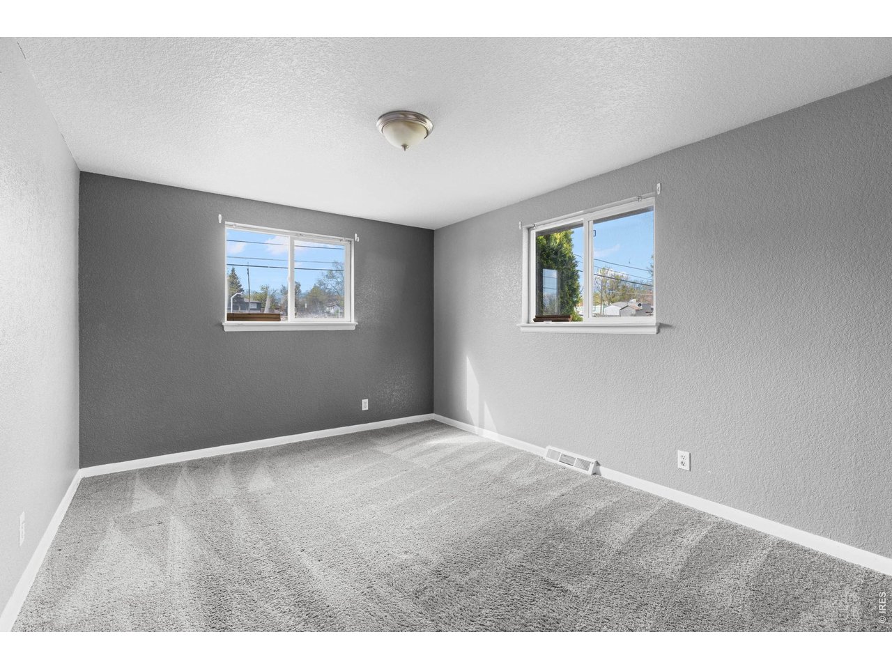 840 South Stuart Street Denver, CO 80219 - Photo 10 of 26 a view of an empty room with a window