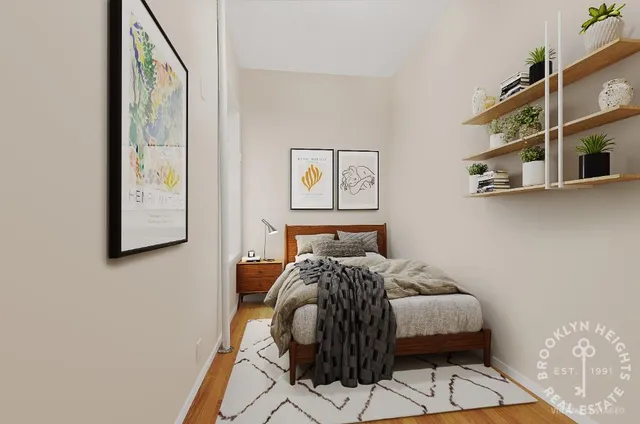 a bedroom with a bed and the view of painting on the wall